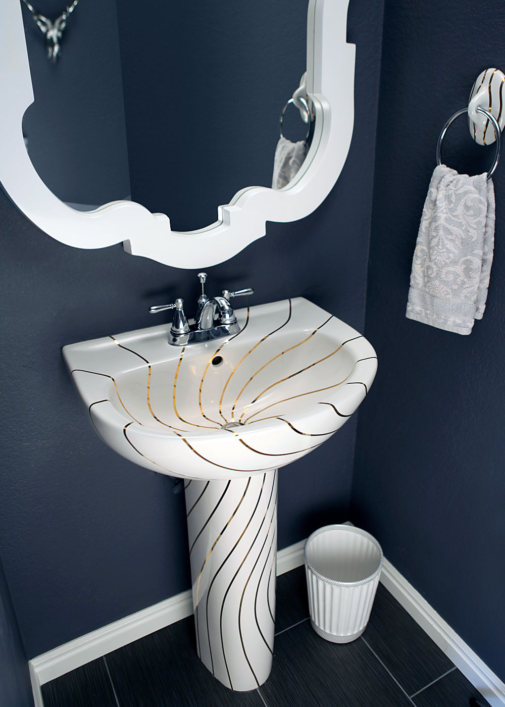 blue powder room with swirling lines hand painted sink