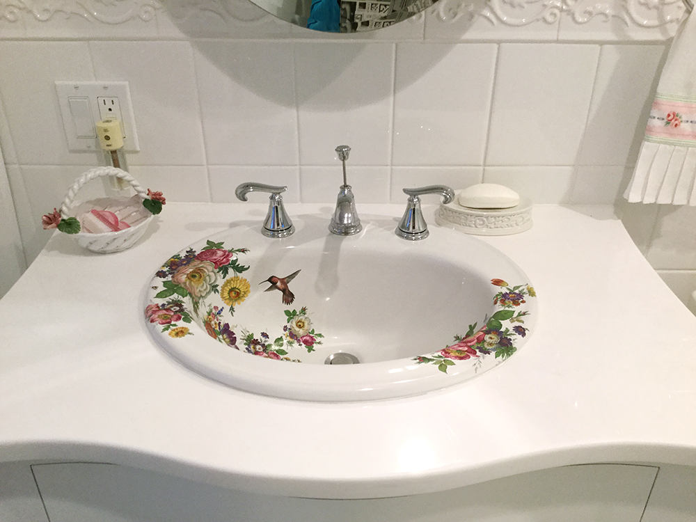 painted sink in white bathroom