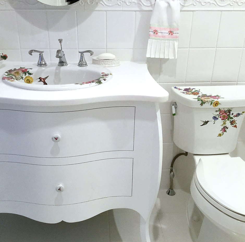white bathroom with floral painted Kohler sink and toilet