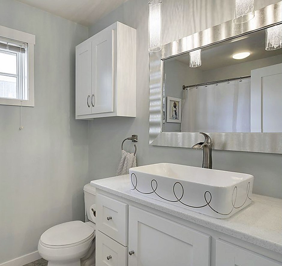 light gray and white bathroom with painted sink