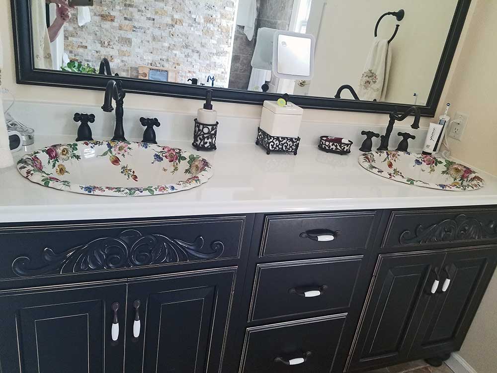 master bathroom with floral painted sinks